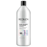 Redken Acidic Bonding Concentrate conditioner bottle close-up showing strong, color-safe conditioning benefits