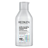 Redken Acidic Bonding Concentrate bottle showing strengthening, sulfate-free formula for damaged hair