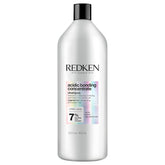 Redken Acidic Bonding Shampoo bottle showing vegan, sulfate-free formula for damaged hair.