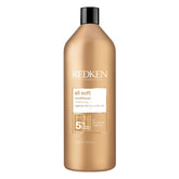 Redken All Soft conditioner bottle pour shows rich hydration and shine