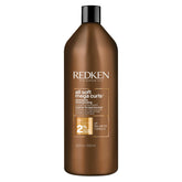 Redken All Soft Mega Curls Shampoo bottle shows a sulfate-free cleanse for dry curls.