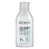 Redken Bonding Shampoo bottle emphasizes damaged hair for stronger strands