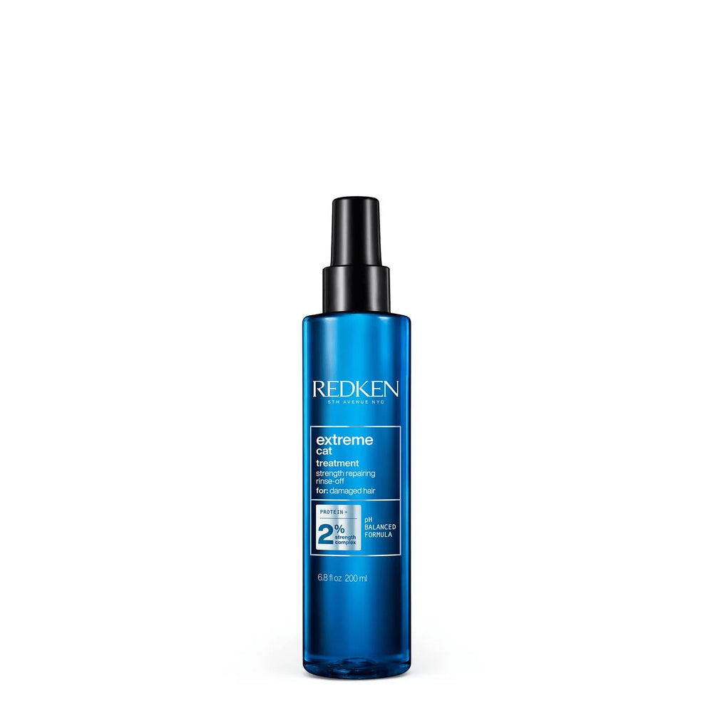 Redken Extreme CAT bottle front showing professional strength for damaged hair