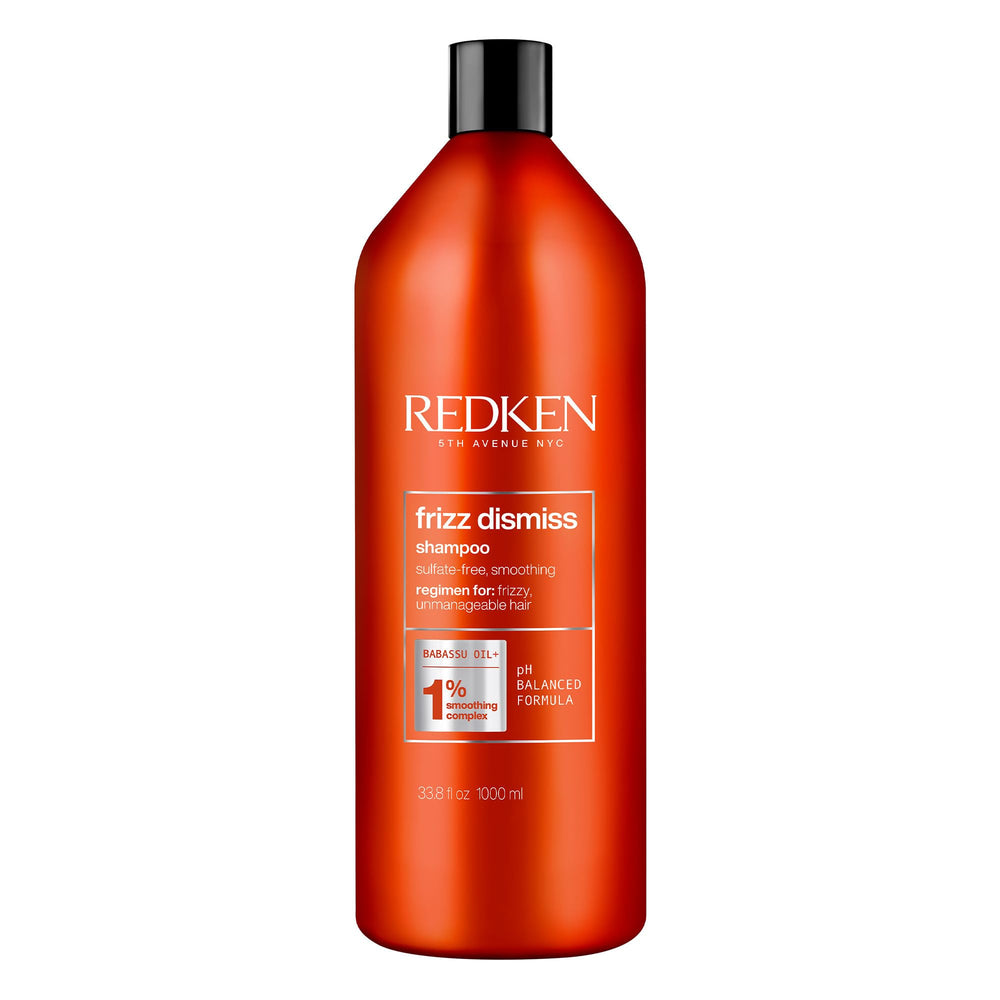 Redken Frizz Dismiss shampoo bottle front for frizz control and shine.