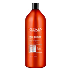 Redken Frizz Dismiss shampoo bottle front for frizz control and shine.