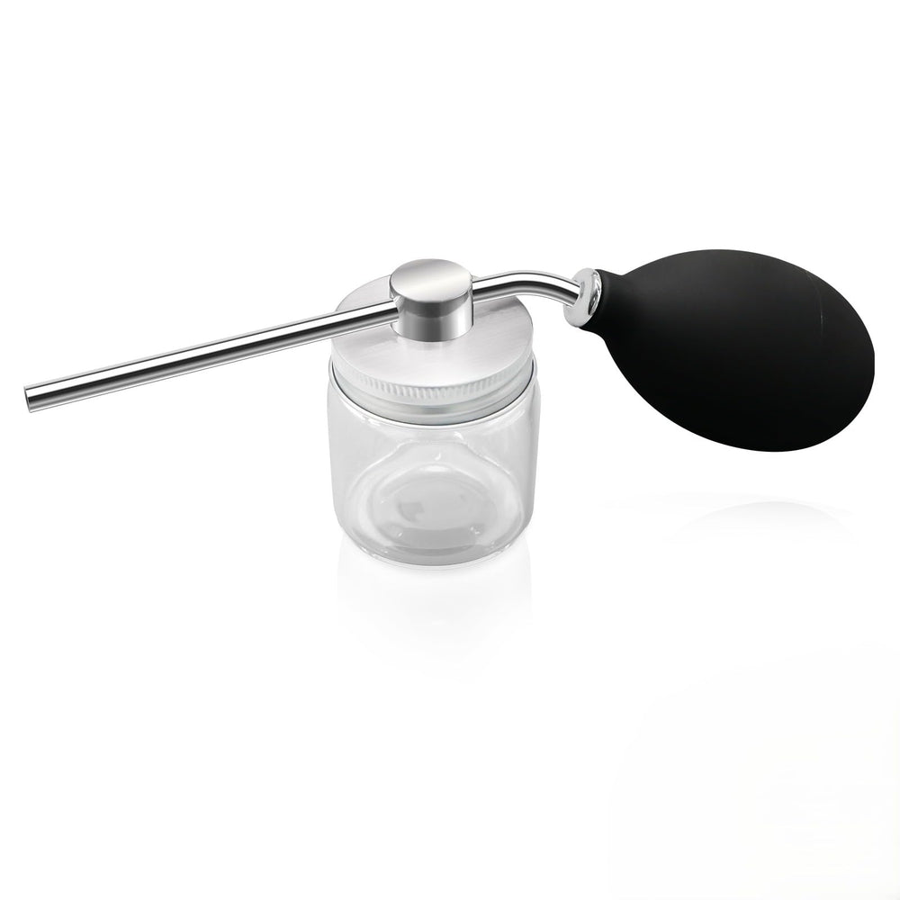 Refillable powder spray bottle close-up with precision nozzle for targeted application and reduced waste.