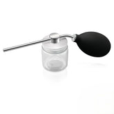 Refillable powder spray bottle close-up with precision nozzle for targeted application and reduced waste.