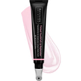 Revision Skincare Tinted YouthFull Lip Replenisher tube closeup shows personalized pink tint and hydration.