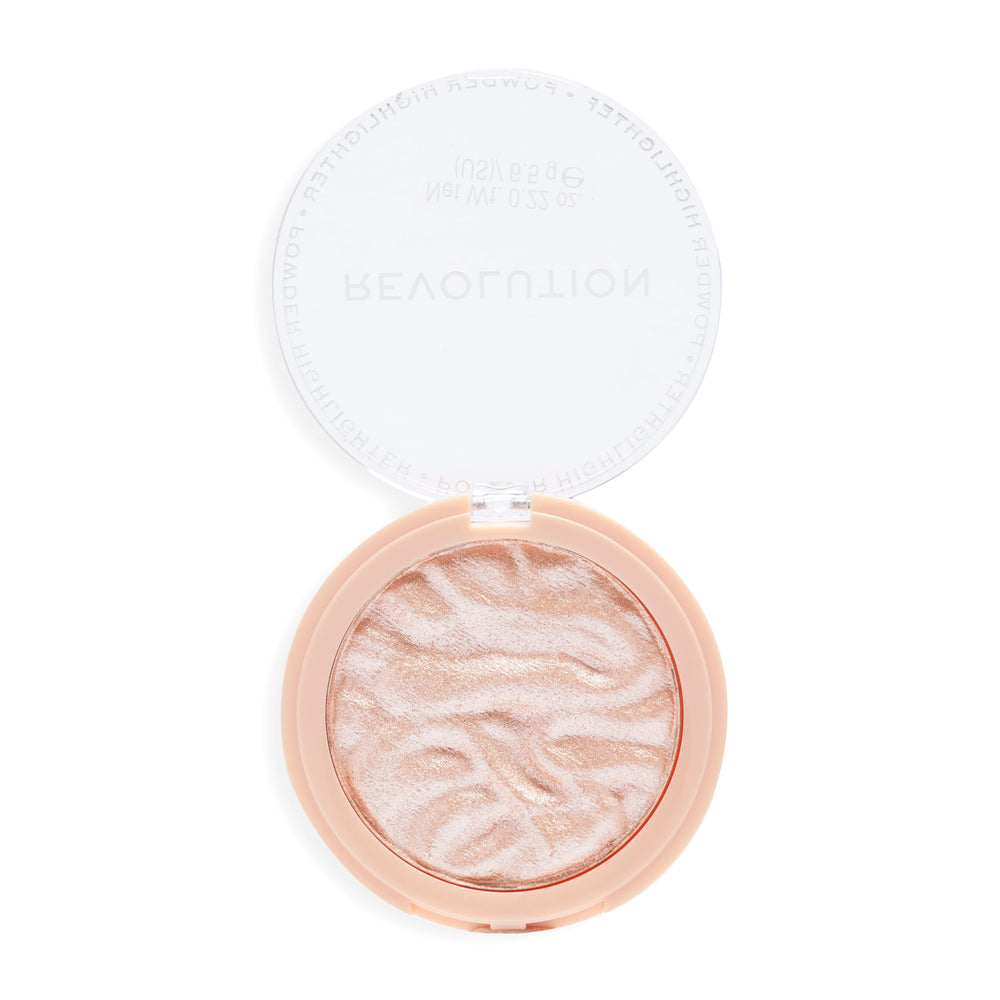 Revolution Beauty London Dare to Divulge highlighter compact for radiant glow.