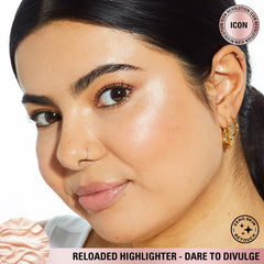 Highlight the nose bridge with a luminous sweep using Revolution highlighter.