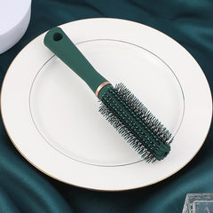 Reazana styling brush ball-tip bristles massage the scalp for comfort.