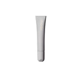 Rhode Salted Carmel lip treatment bottle showing compact, glossy finish for on-the-go use.
