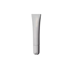 Rhode Salted Carmel lip treatment bottle showing compact, glossy finish for on-the-go use.