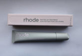 Rhode Watermelon Slice Lip Treatment bottle delivering hydration with a glossy finish.