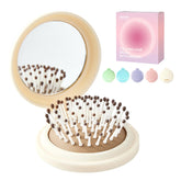 RHOS compact foldable hair brush with mirror closed in beige for quick touch-ups.