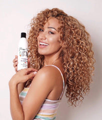 Dispensador de Rizos Curls para dosis precisas.