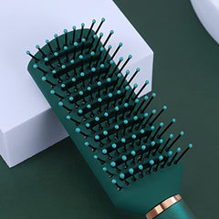RN BEAUTY detangling brush in dark green with vented design for airflow
