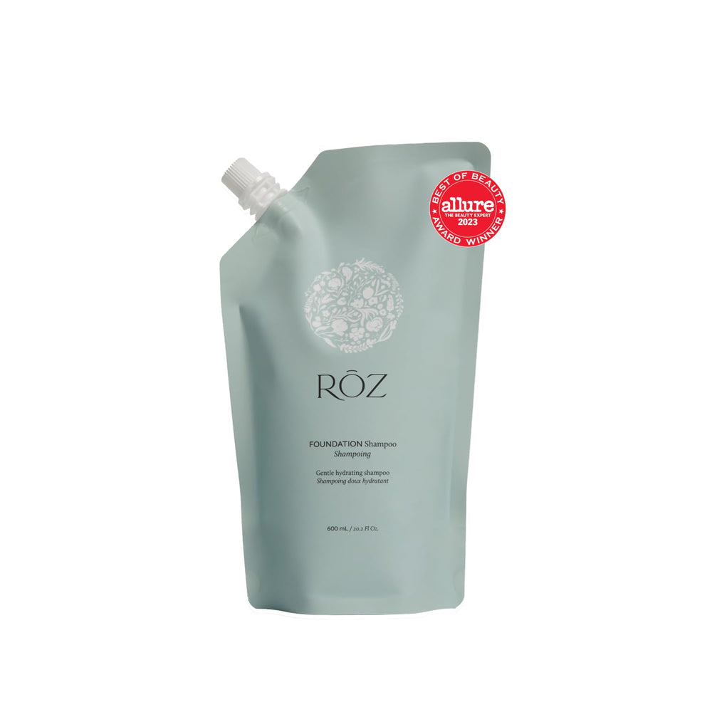 RŌZ Foundation Shampoo refill bottle pour demonstrates easy replenishment for sustainable routines.