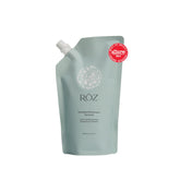 RŌZ Foundation Shampoo refill bottle pour demonstrates easy replenishment for sustainable routines.