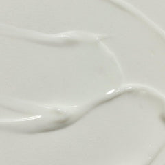 RŌZ Milk Hair Serum texture close-up shows creamy glide