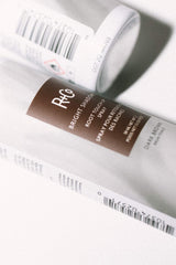 Dark brown shade swatch showing natural blend and shine