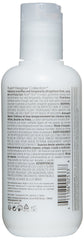 Aplicación en cabello mojado con RUSK Str8 para peinado definido.