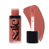Saie Dew Liquid Blush bottle close-up showing sleek vegan formula.
