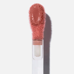 Swatch of Saie Dew on cheek for natural dewy glow.