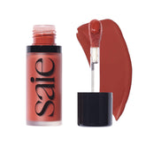 Saie Dew Liquid Blush Spicy with doe-foot applicator on cheek for a natural glow