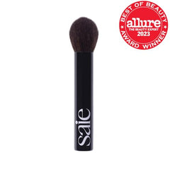 Saie The Fluffy Brush with tapered tip for precise placement on skin
