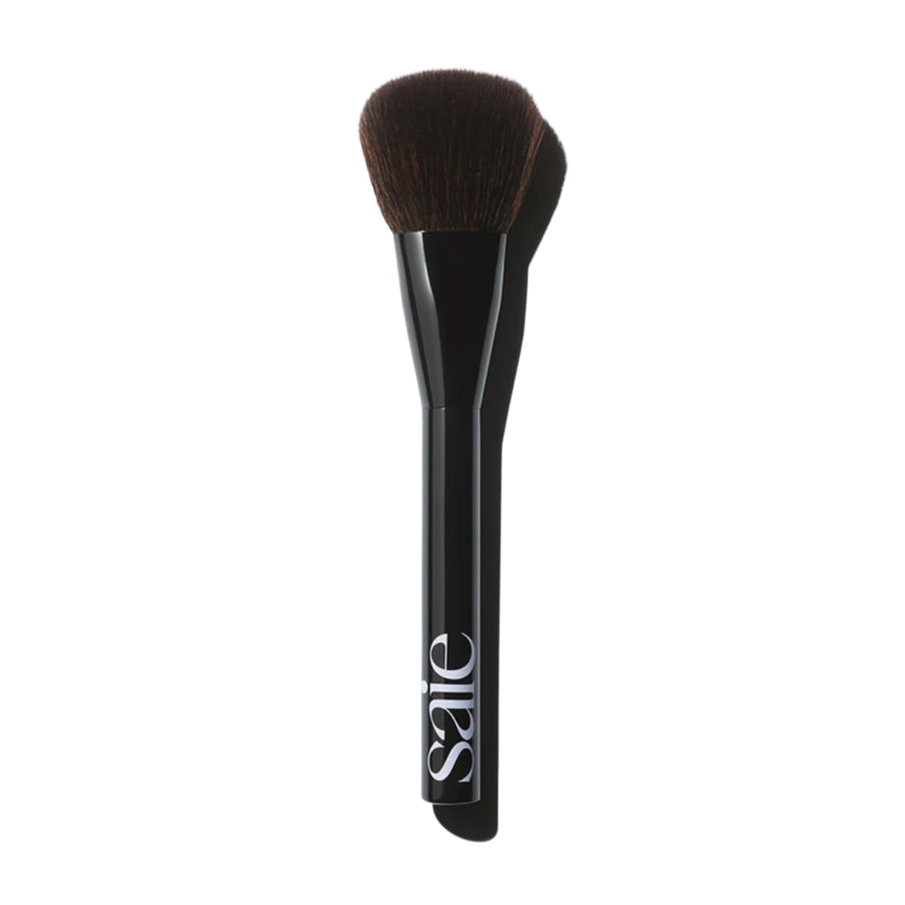 Saie Powder Blush Brush headshot showing fluffy bristles for diffused blush