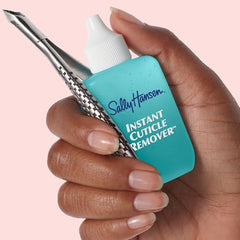 Sally Hansen Instant Cuticle Remover packaging beside bottle highlights Aloe Chamomile.