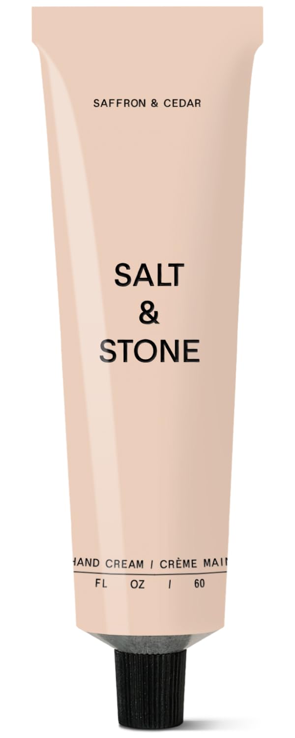 Salt & Stone hand cream bottle with saffron and cedar scent for daily moisture.
