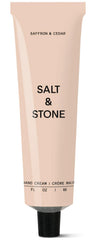 Salt & Stone hand cream bottle with saffron and cedar scent for daily moisture.