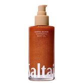 Saltair Shimmering Body Oil bottle closeup showing pearlescent glow for hydrated skin