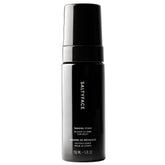 SALTYFACE tanning foam bottle demonstrates oil-free, fragrance-free formula for smooth application.