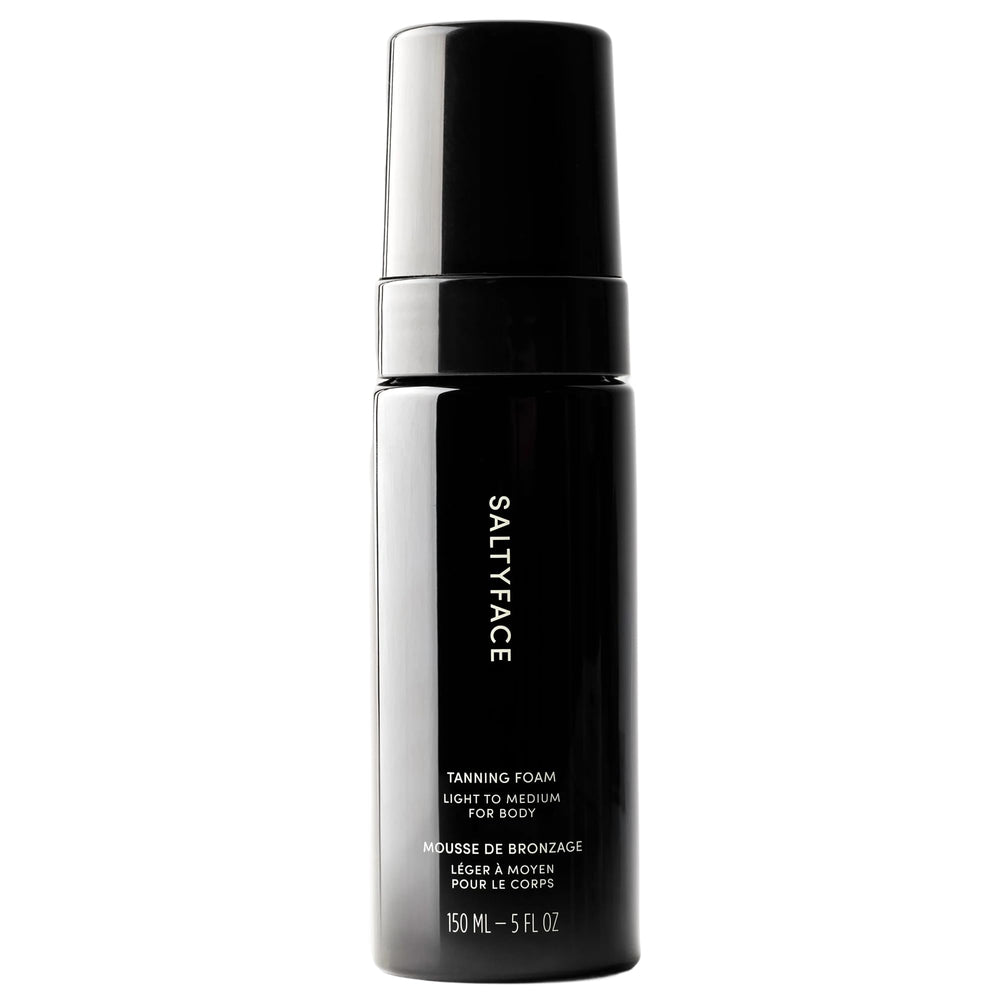 SALTYFACE tanning foam on full body for a natural, transfer-free glow.