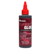Sassi Eyelash Glue Dark 2oz bottle close-up for precise, durable lash bond.