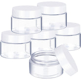 SATINIOR 6-pack clear jars with white lids for travel storage and cosmetics