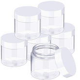 SATINIOR 6-pack 3 oz clear jars with screw-on lids for travel storage.