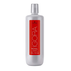 Schwarzkopf Igora Royal Oil Developer being poured for smooth application.