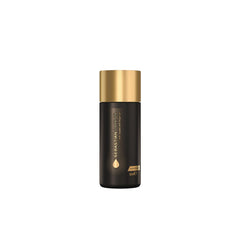 Sebastian Dark Oil bottle close-up showing lightweight detangling benefits.