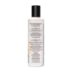 SEEN Shampoo bottle close-up highlights a smooth, non-stripping wash.