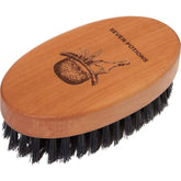 Seven Potions beard brush with first-cut boar bristles for precise grooming.