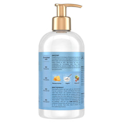 Product bottle of SheaMoisture Hydrate & Repair Conditioner shows a rich, nourishing formula.