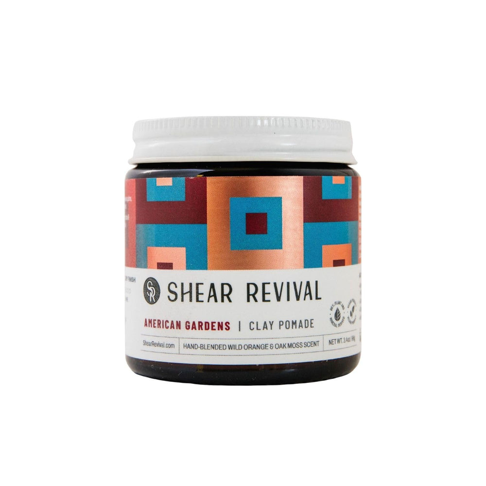Shear Revival American Gardens Clay Pomade packaging in an amber jar highlights eco-friendly packaging