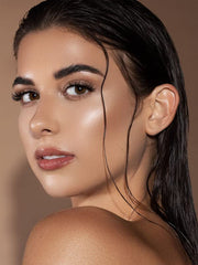 SHEGLAM Glow Bloom cap close-up shows creamy texture for seamless blending.