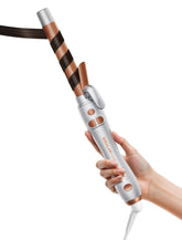 SHEGLAM rotating curling iron with extralong barrel for long hair and smooth curls.