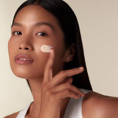 Shiseido Benefiance jar being dispensed for quick morning routine.