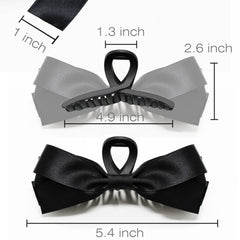 Sizobi bow claw clip white close-up highlights glossy satin bow and gentle hold